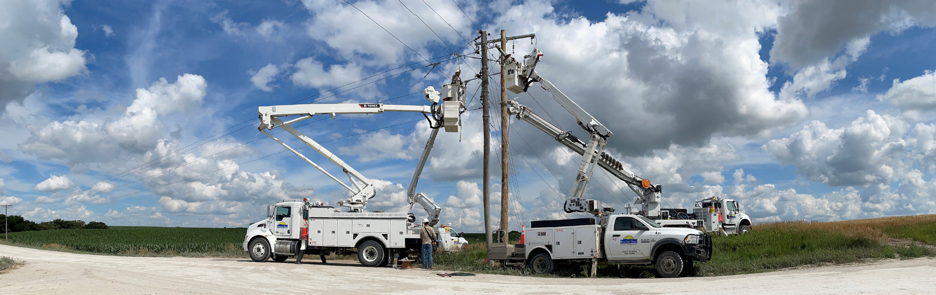Lineman trucks on side of road