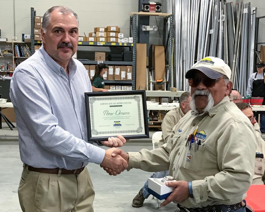 Rolling Hills Manager awards certificate to employee